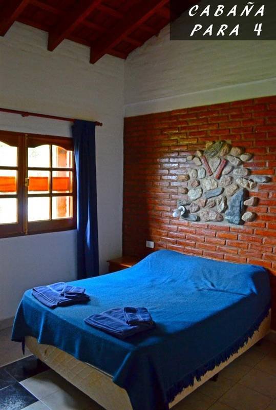 Dormitorio de una cabaña para 4 personas en Complejo Laguna Azul, Los Molles, San Luis